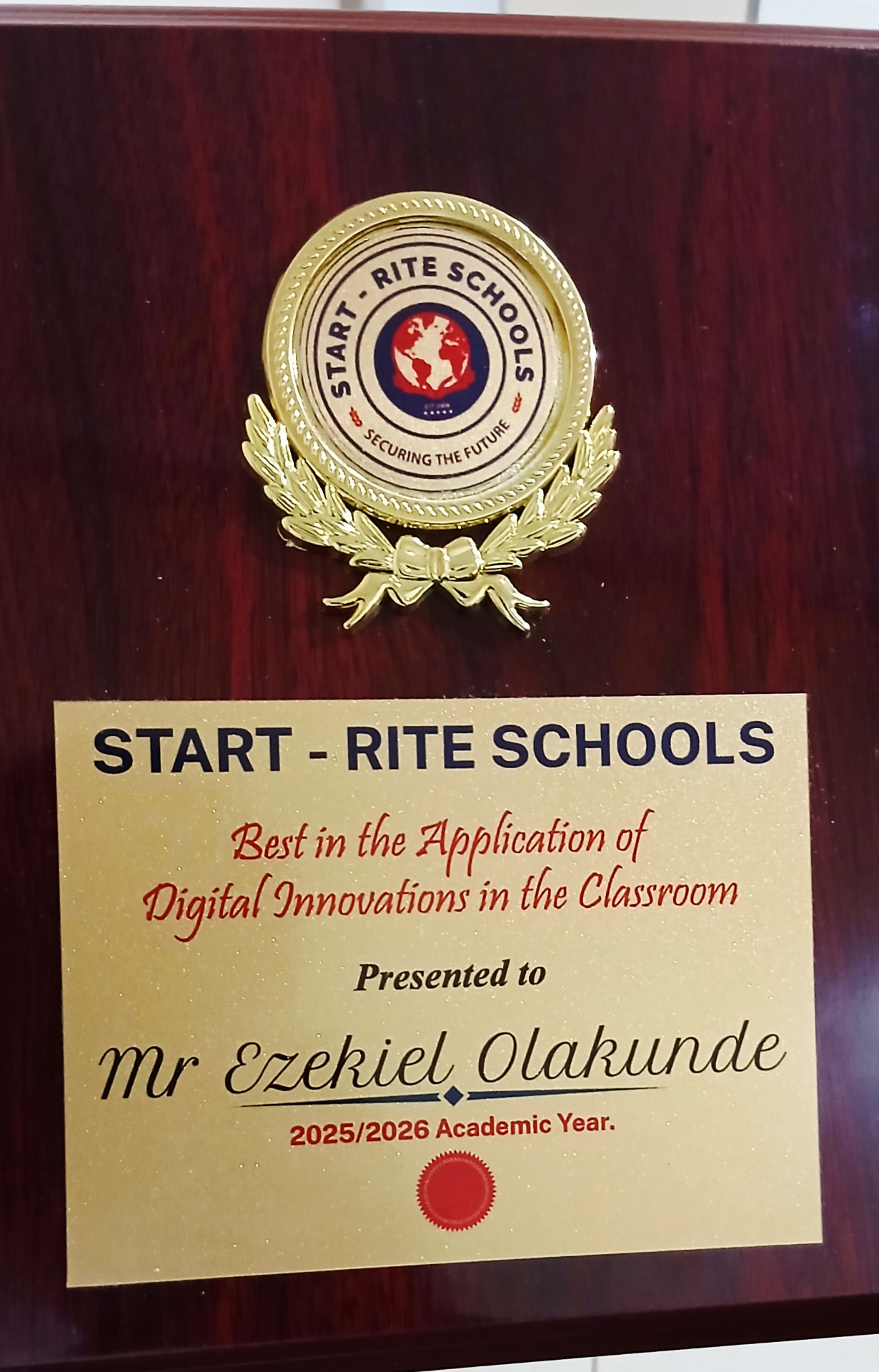 Start-Rite Schools award plaque for Best in the Application of Digital Innovations in the Classroom, presented to Mr Ezekiel Olakunde
